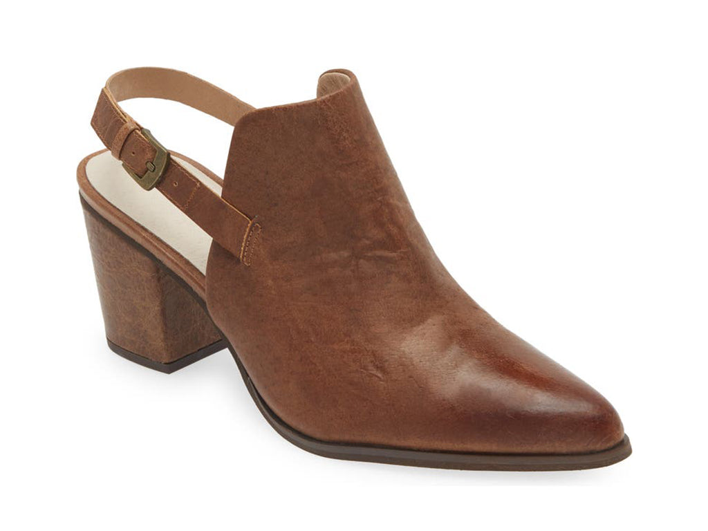 Brown pointed toe shoe with block heel and buckle ankle back strap on a white background side angle view