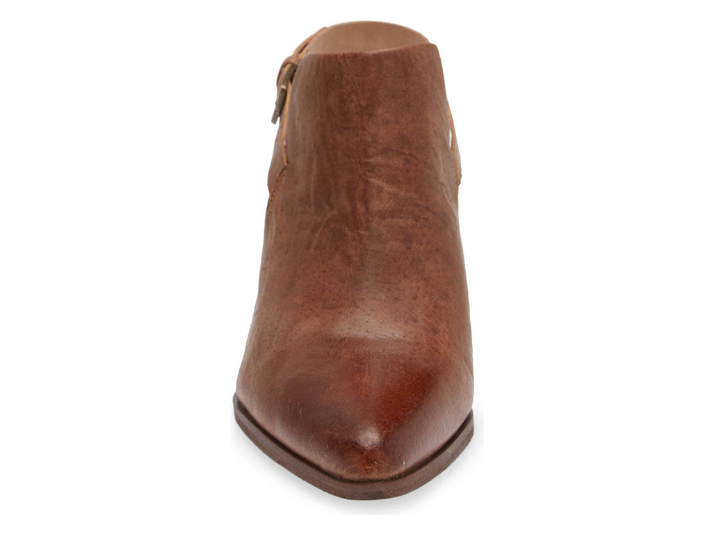 Brown pointed toe shoe with block heel and buckle ankle back strap on a white background front view