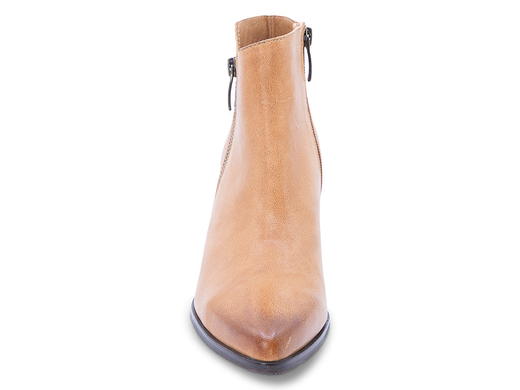 A caramel leather ankle boot with a side zipper and a dark block heel - front view