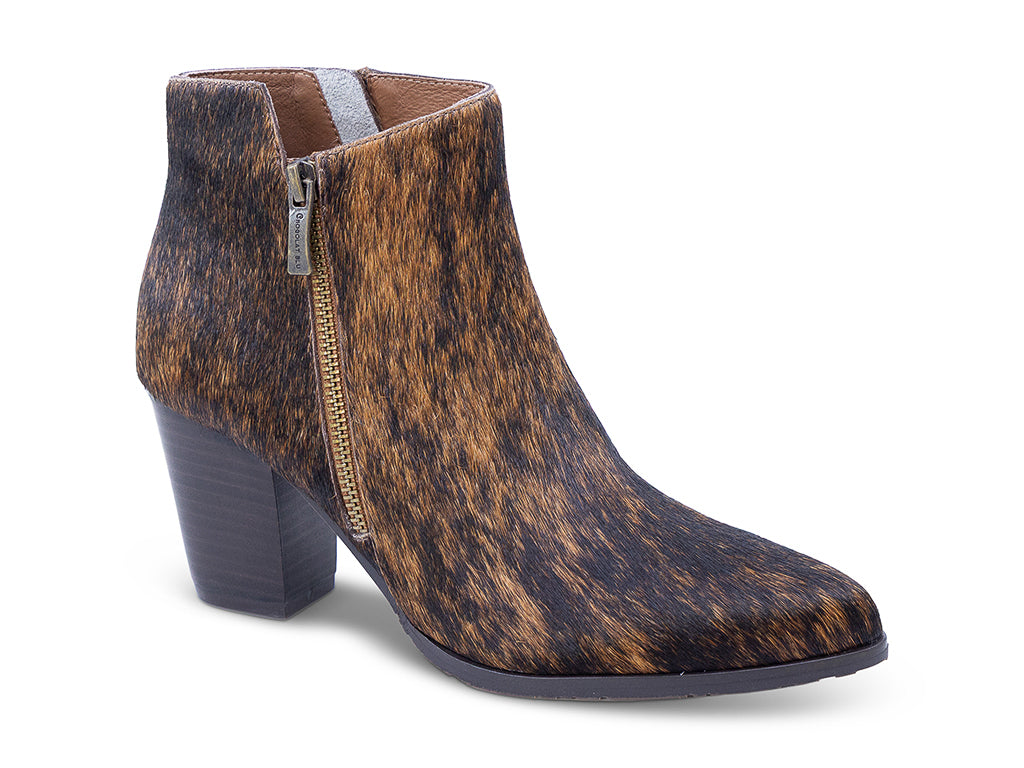 calf hair ankle boot with a brown and black mottled cowhide pattern, dark gray block heel, a pointed toe, and a side zipper - front 3/4 view