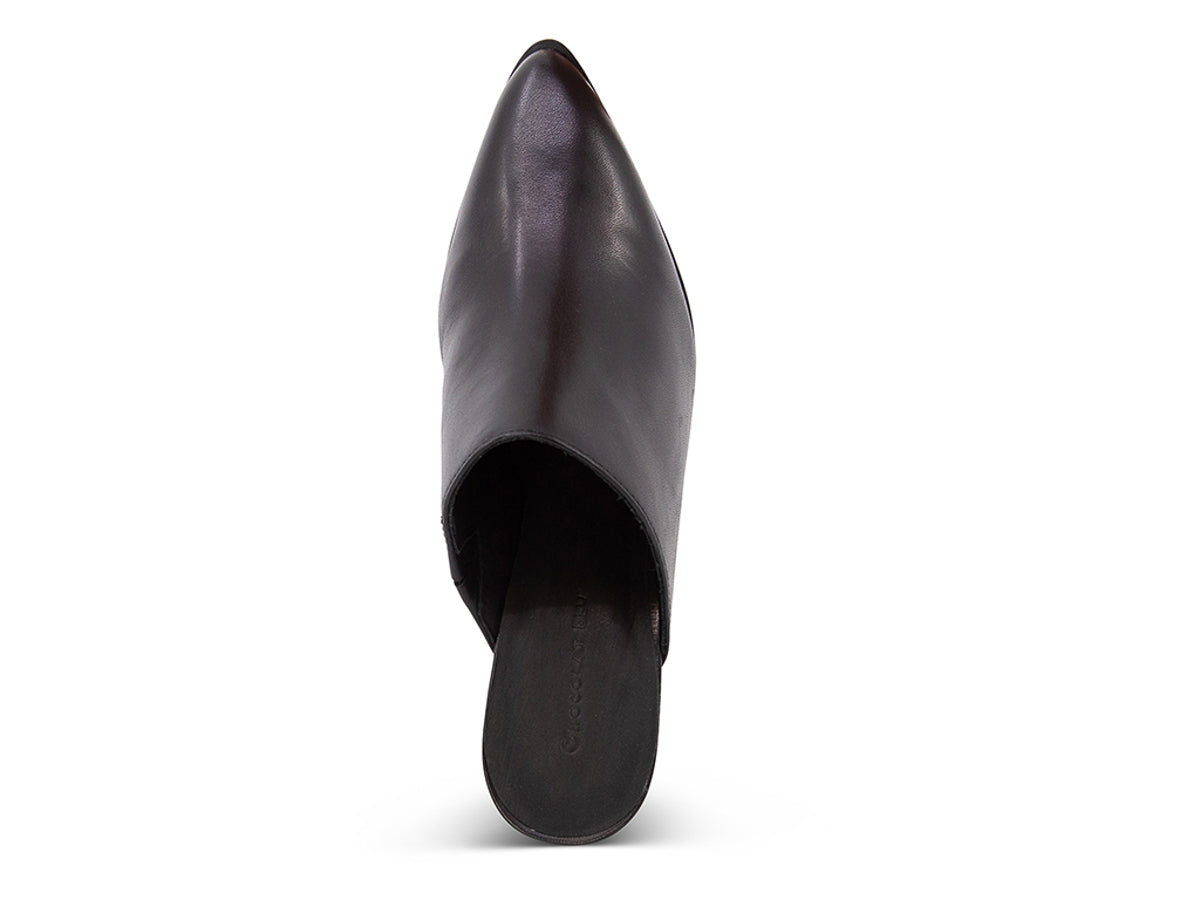 Black leather slide in pointed toe with block heel on a white background top view