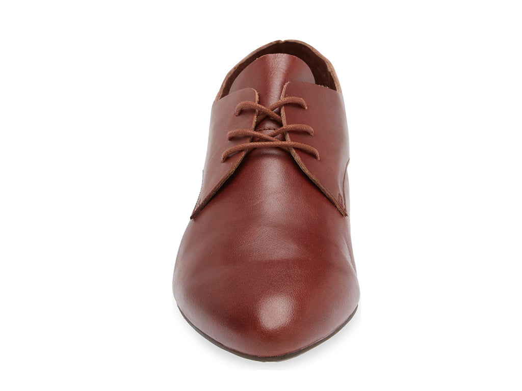 Brown leather lace-up pointed toe flat with mini block heel on a white background front view