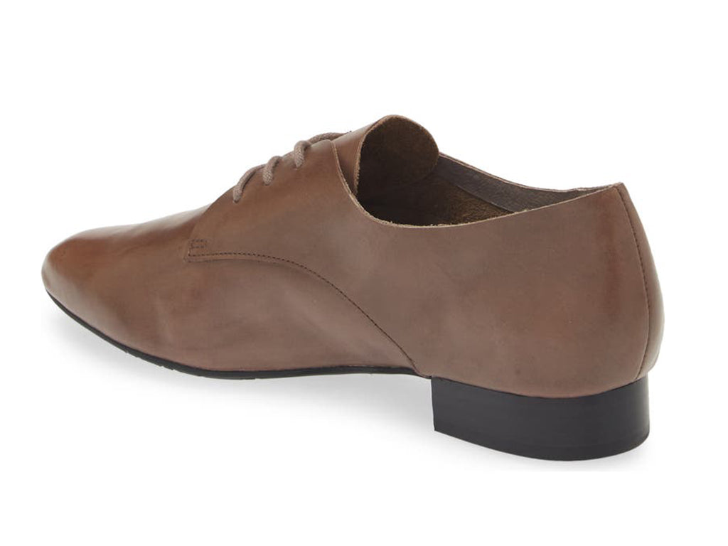 Grey leather lace-up pointed toe flat with mini block heel on a white background side angle view