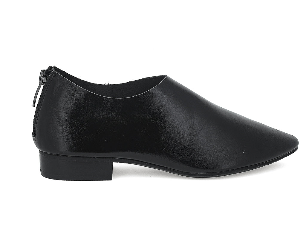 Black leather pointed toe flat with mini block heel and back zipper on a white background side view
