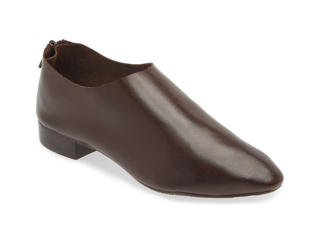 Dark Brown leather pointed toe flat with mini block heel and back zipper on a white background side angle view