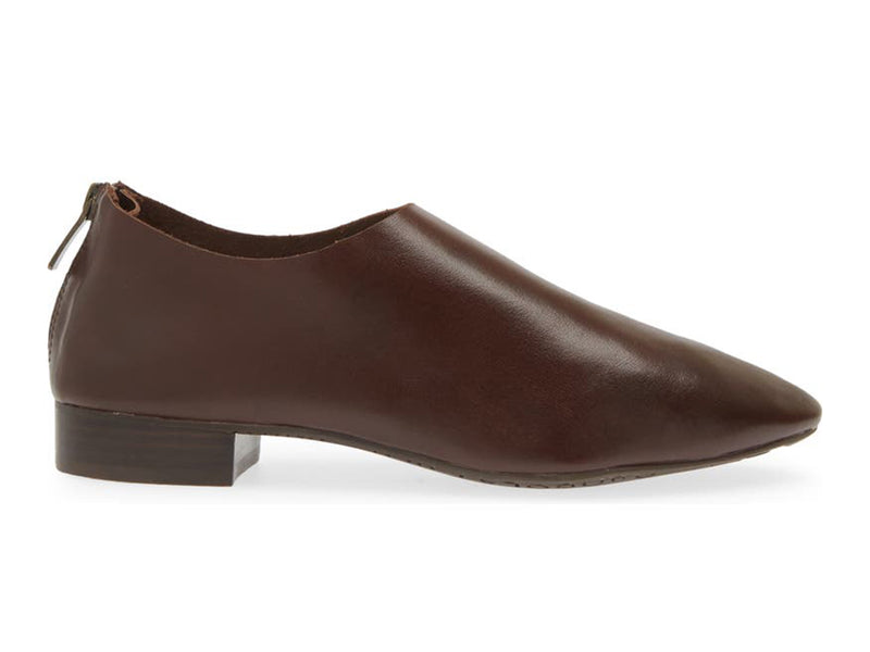 Dark Brown leather pointed toe flat with mini block heel and back zipper on a white background side view