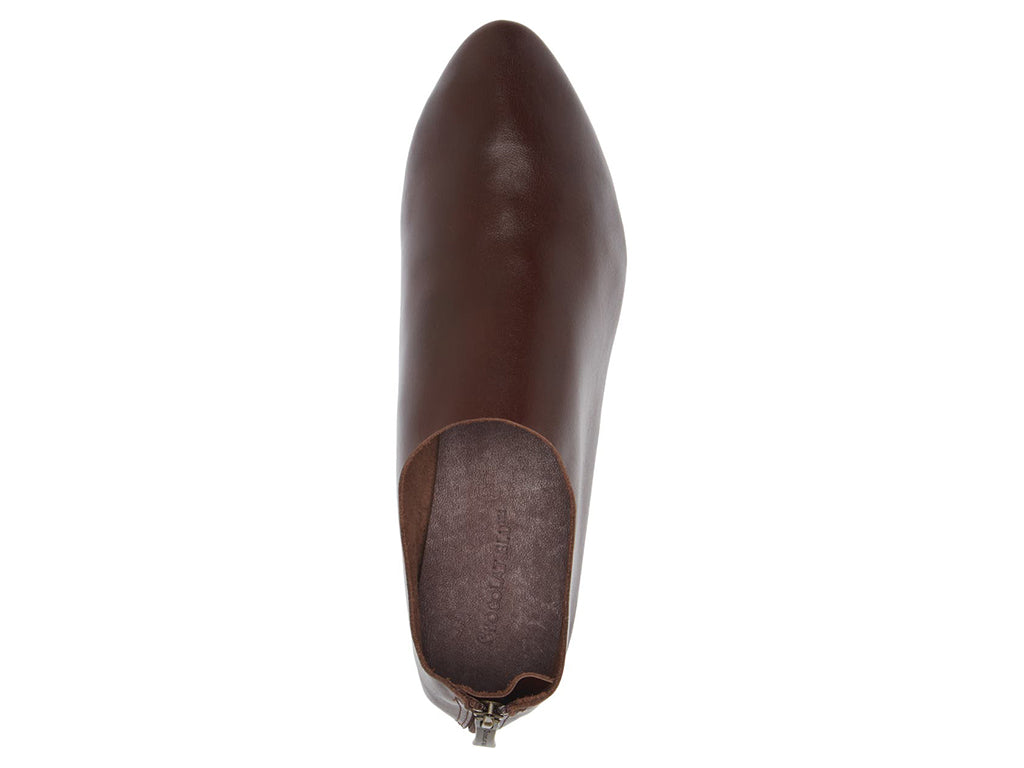Dark Brown leather pointed toe flat with mini block heel and back zipper on a white background top view