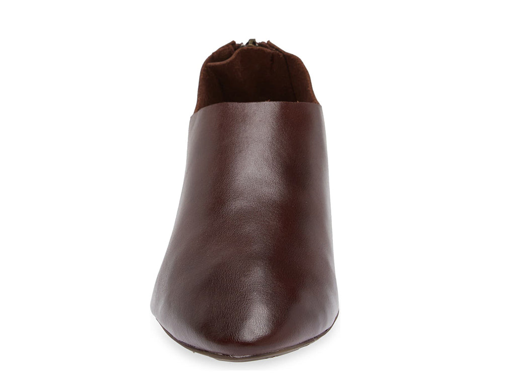 Dark Brown leather pointed toe flat with mini block heel and back zipper on a white background front view