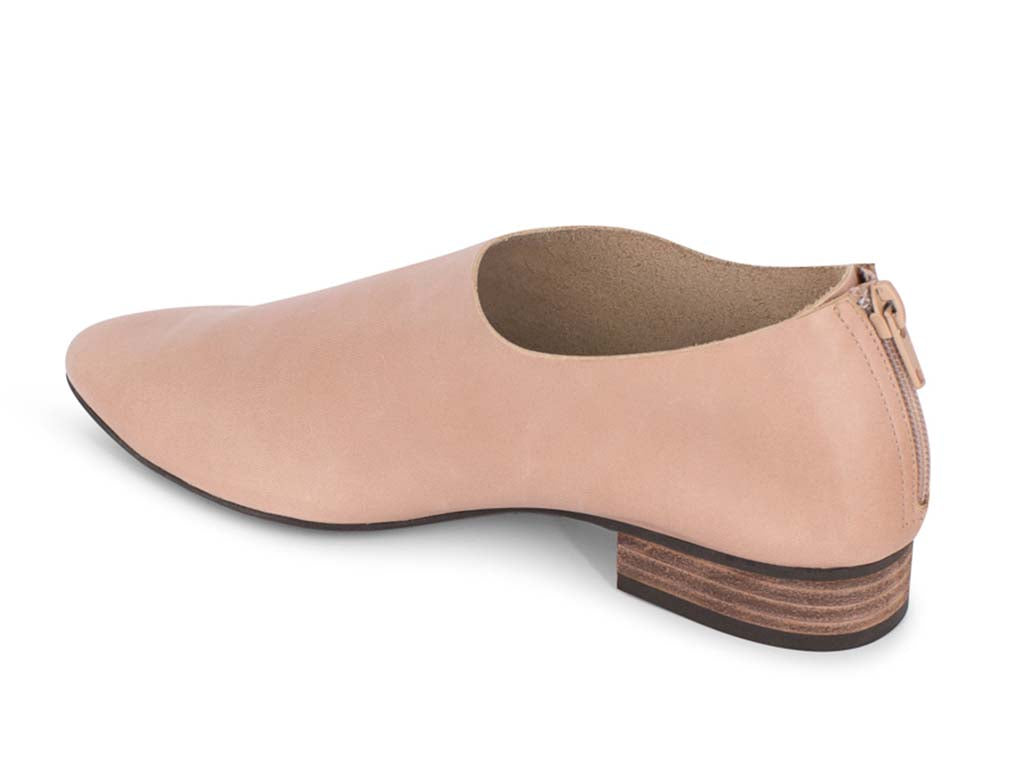 Latte leather pointed toe flat with mini block heel and back zipper on a white background side angle view