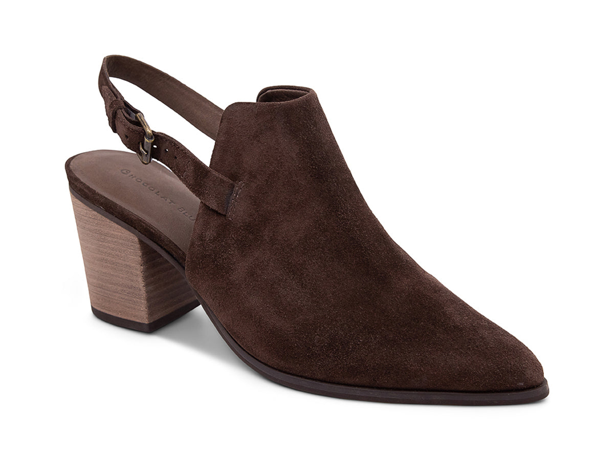 Brown suede pointed toe shoe with wooden block heel and buckle ankle back strap on a white background side angle view 