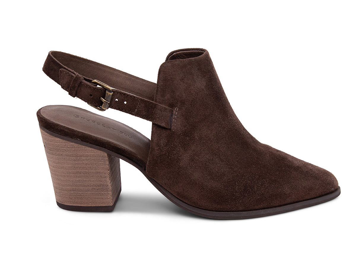 Brown suede pointed toe shoe with wooden block heel and buckle ankle back strap on a white background side view