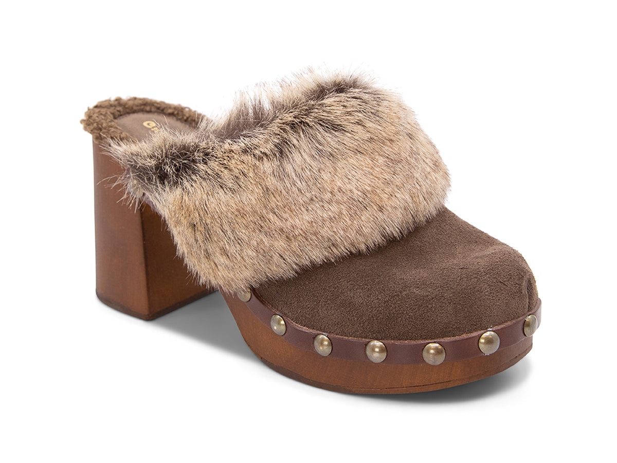Brown heeled clog shoe with fur trim and grommet studs  on a white background side angle view
