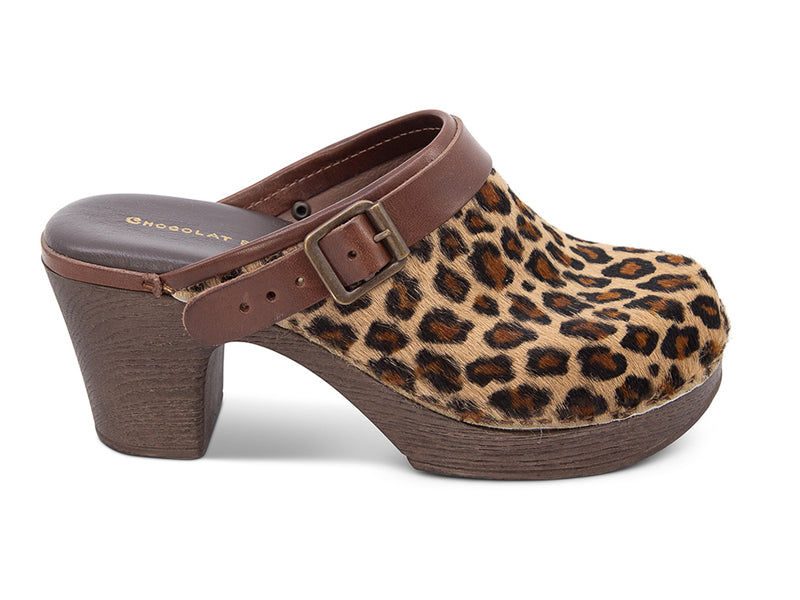 Leopard print heeled clog shoe with strap and buckle on a white background side view