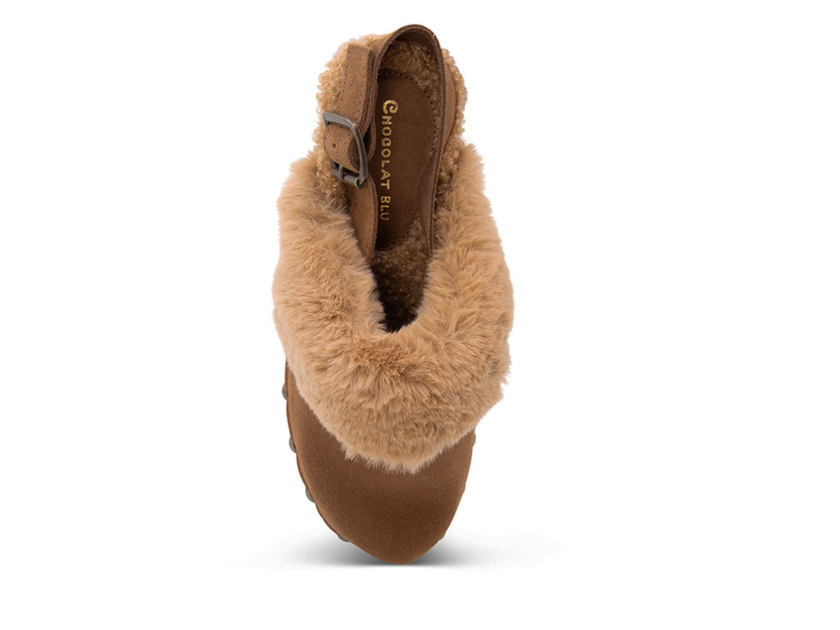 Brown heeled clog shoe with fur trim and grommet studs on a white side background top view
