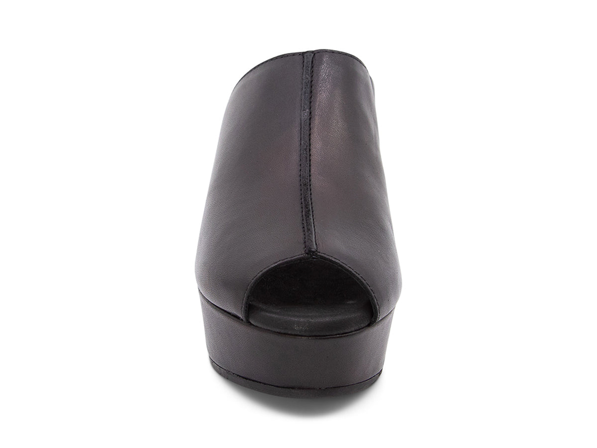 Black leather platform wedge peep-toe boot on a block heel with exposed seam design on upper on a white background front view