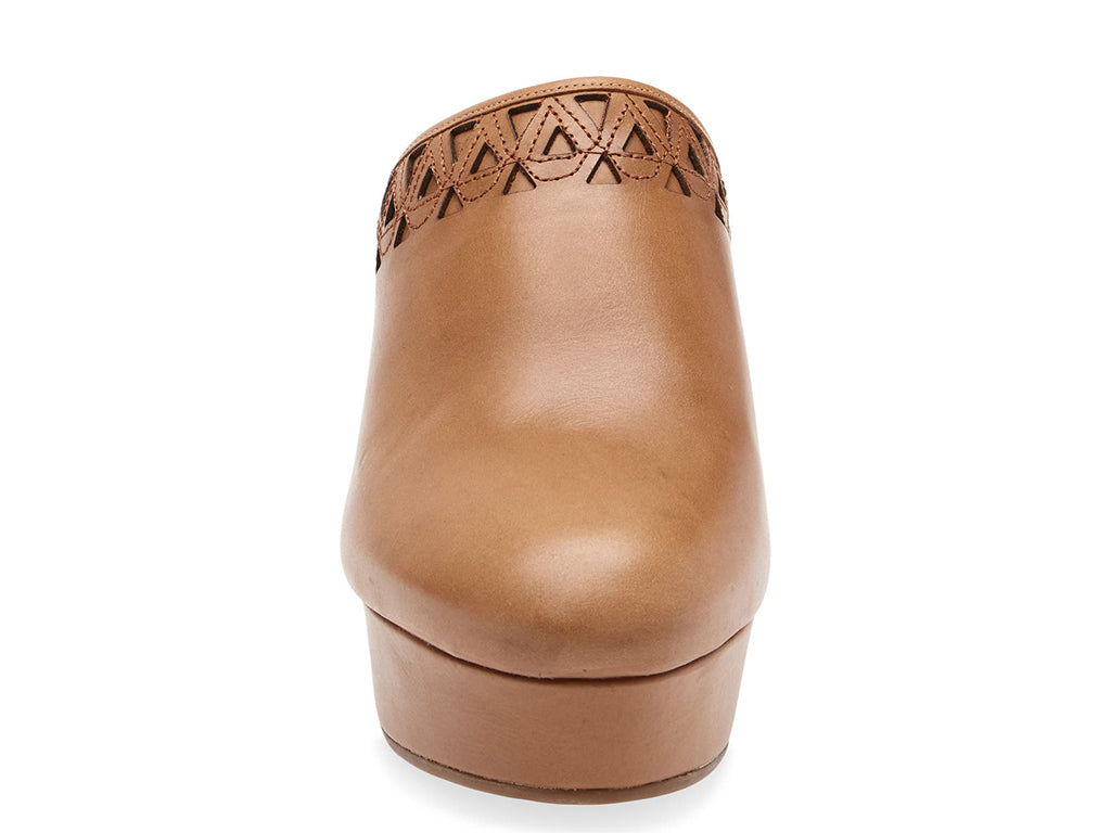 Brown heeled clog shoe with decorative cutout on upper and fur trim mid sole on a white background front view