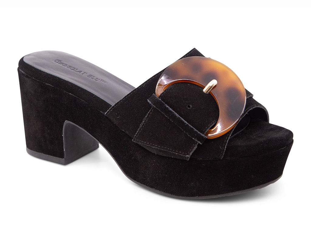 Black suede platform sandal with tortoiseshell buckle on a platform with block heel