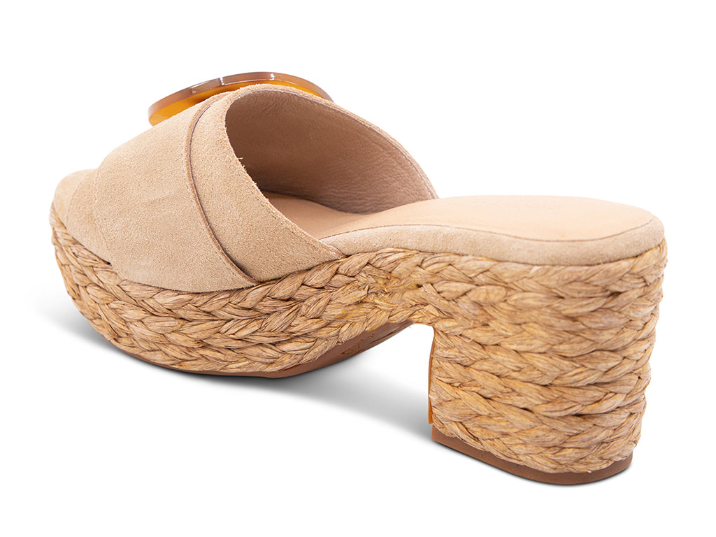 latte suede sandal with a moon shaped buckle on a raffia wrapped platform - back angle view