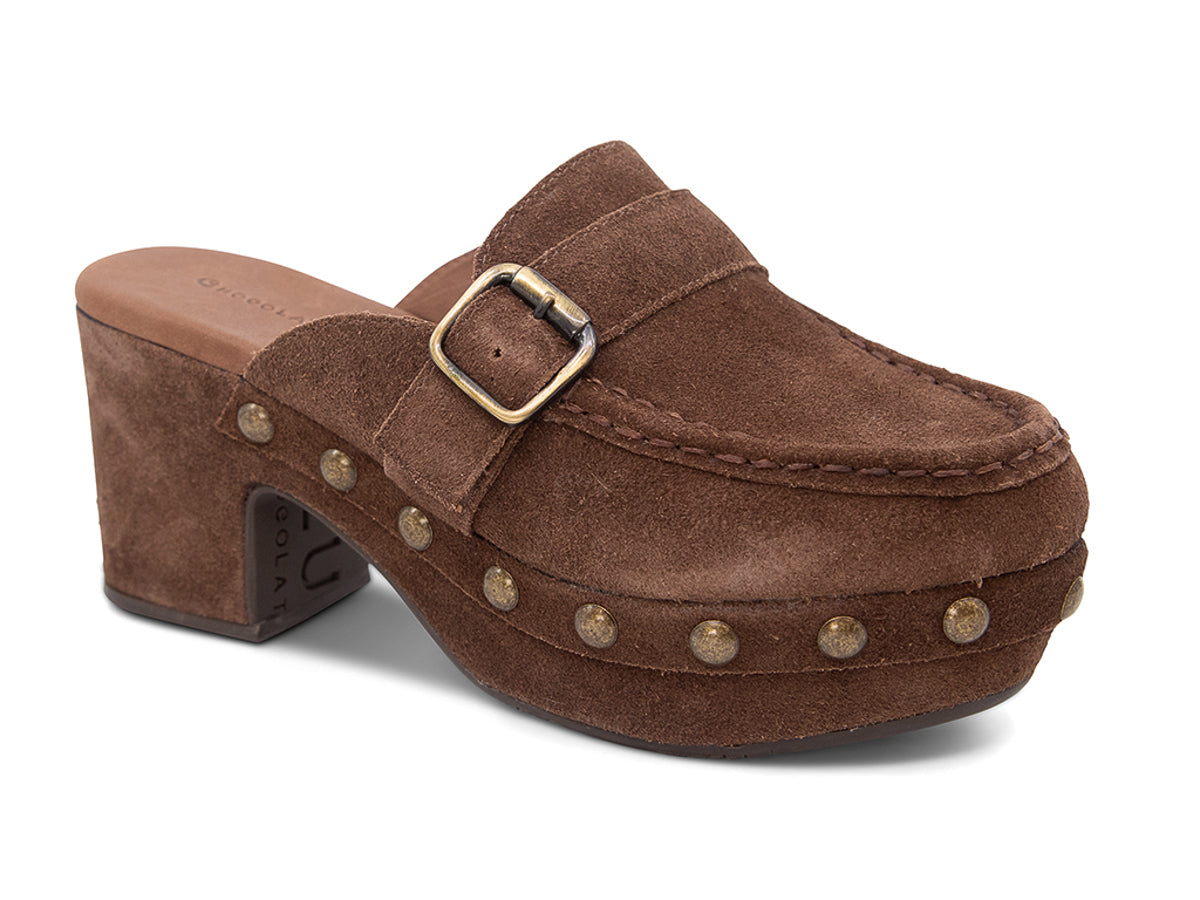 Chocolate suede slide in block heel clog shoe with a decorative strap buckle and grommet studson a white background side angle view 