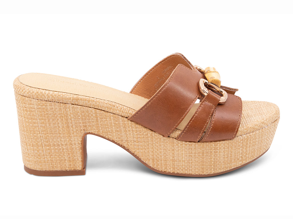 brown sandal with bamboo toggle buckle on a raffia wrapped platform and block heel - side view