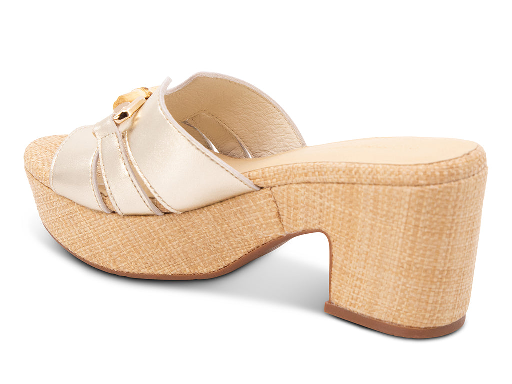 gold metallic sandal with bamboo toggle buckle on a raffia wrapped platform and block heel - view from the back
