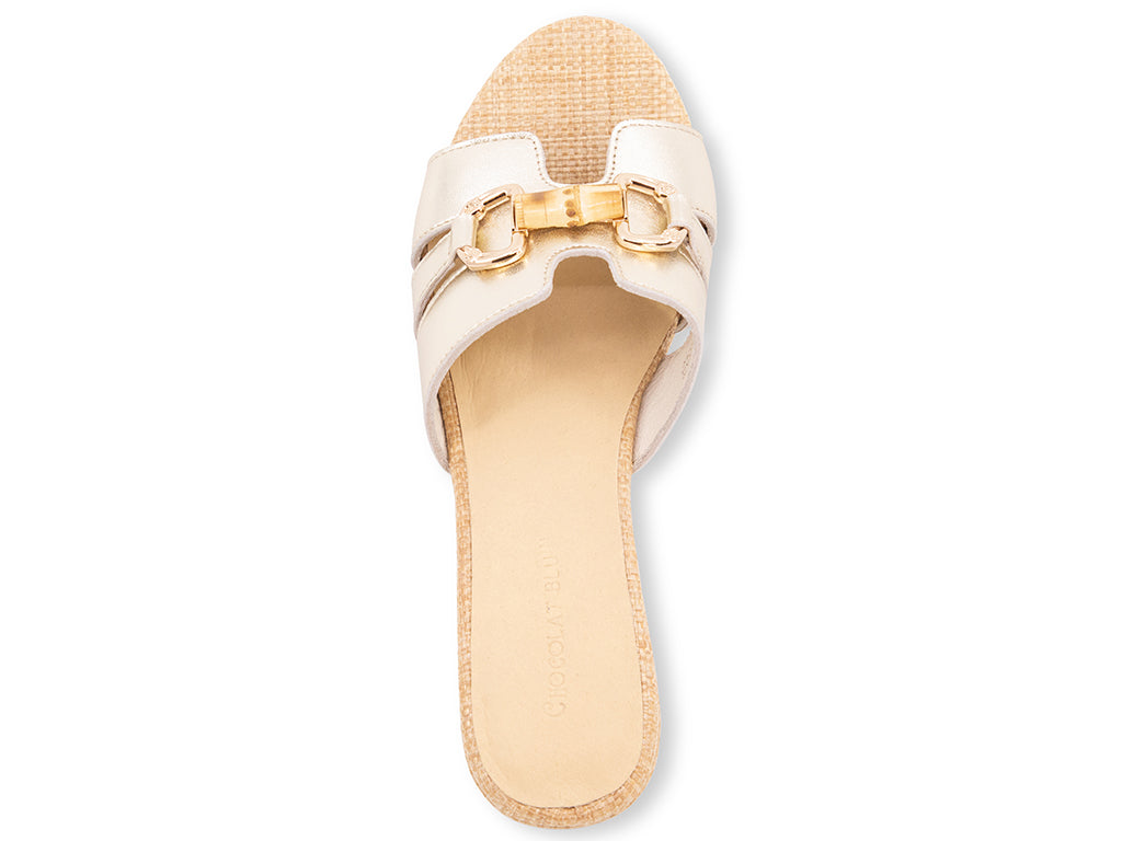 gold metallic sandal with bamboo toggle buckle on a raffia wrapped platform and block heel - top view