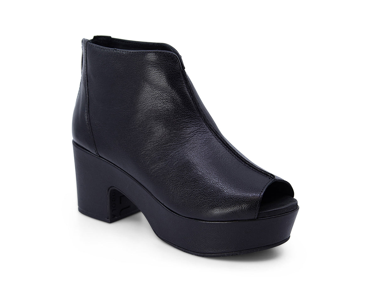 Black leather peep toe ankle boot with platform sole and bakc zipper on a white background side angle view
