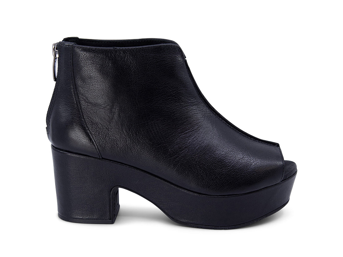 Black leather peep toe ankle boot with platform sole and bakc zipper on a white background side view