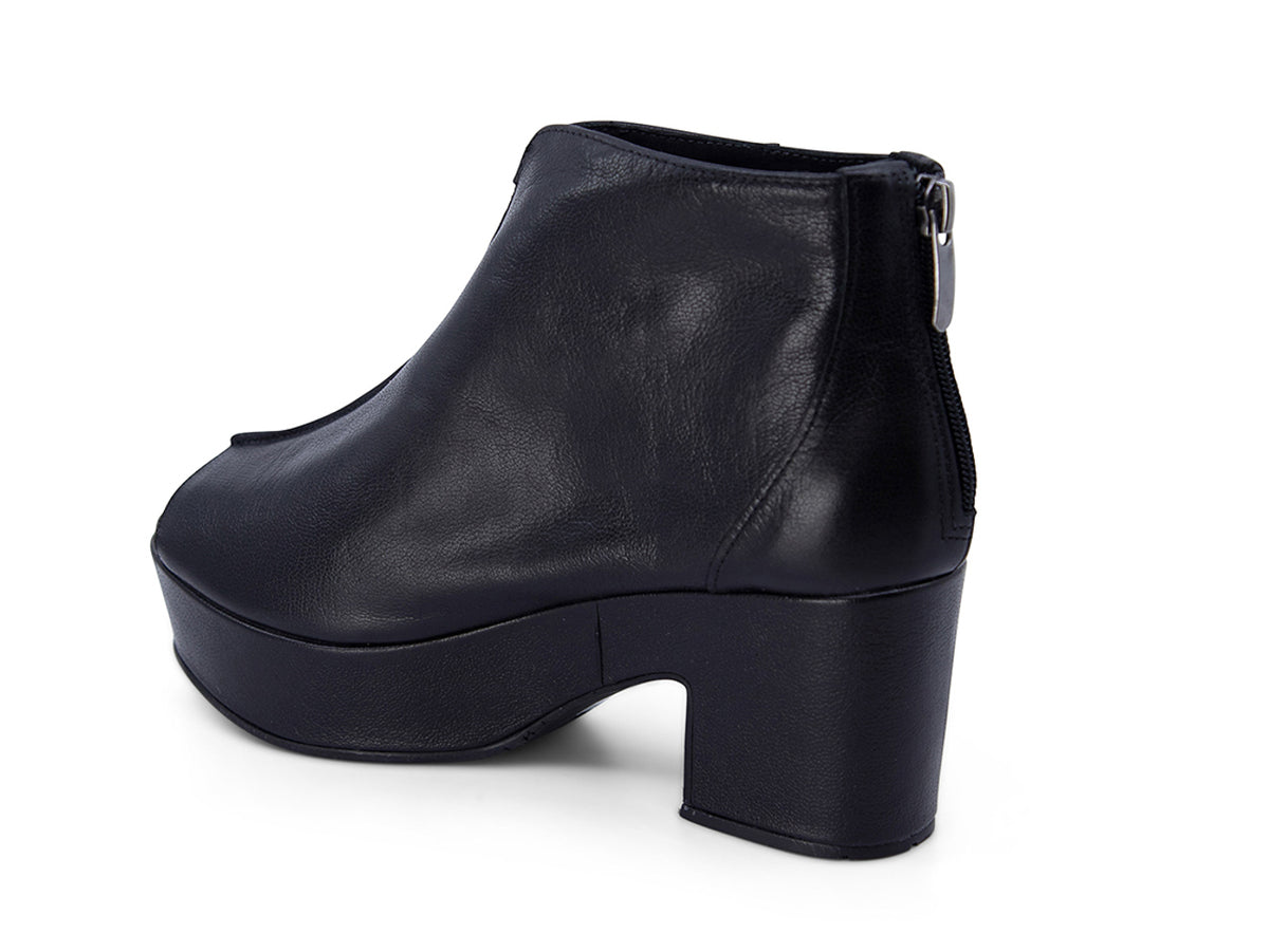 Black leather peep toe ankle boot with platform sole and bakc zipper on a white background side angle view