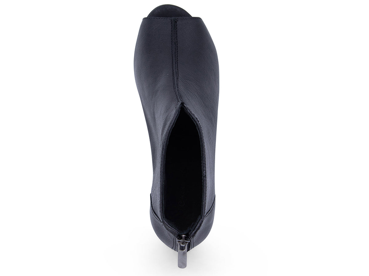 Black leather peep toe ankle boot with platform sole and bakc zipper on a white background top view