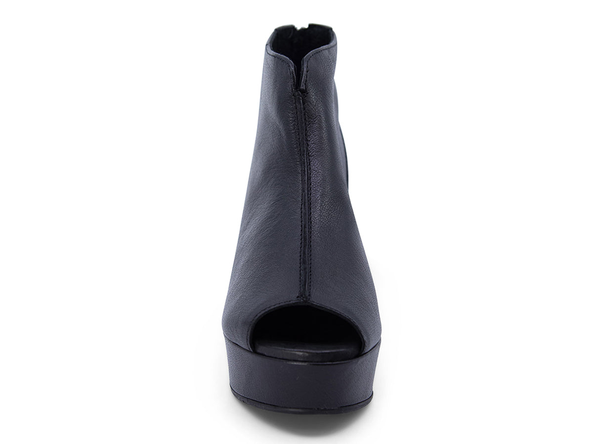 Black leather peep toe ankle boot with platform sole and bakc zipper on a white background front view