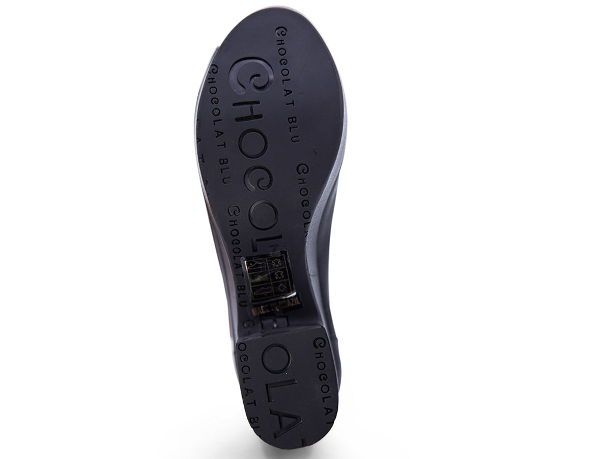 Black leather peep toe ankle boot with platform sole and bakc zipper on a white background bottom sole view