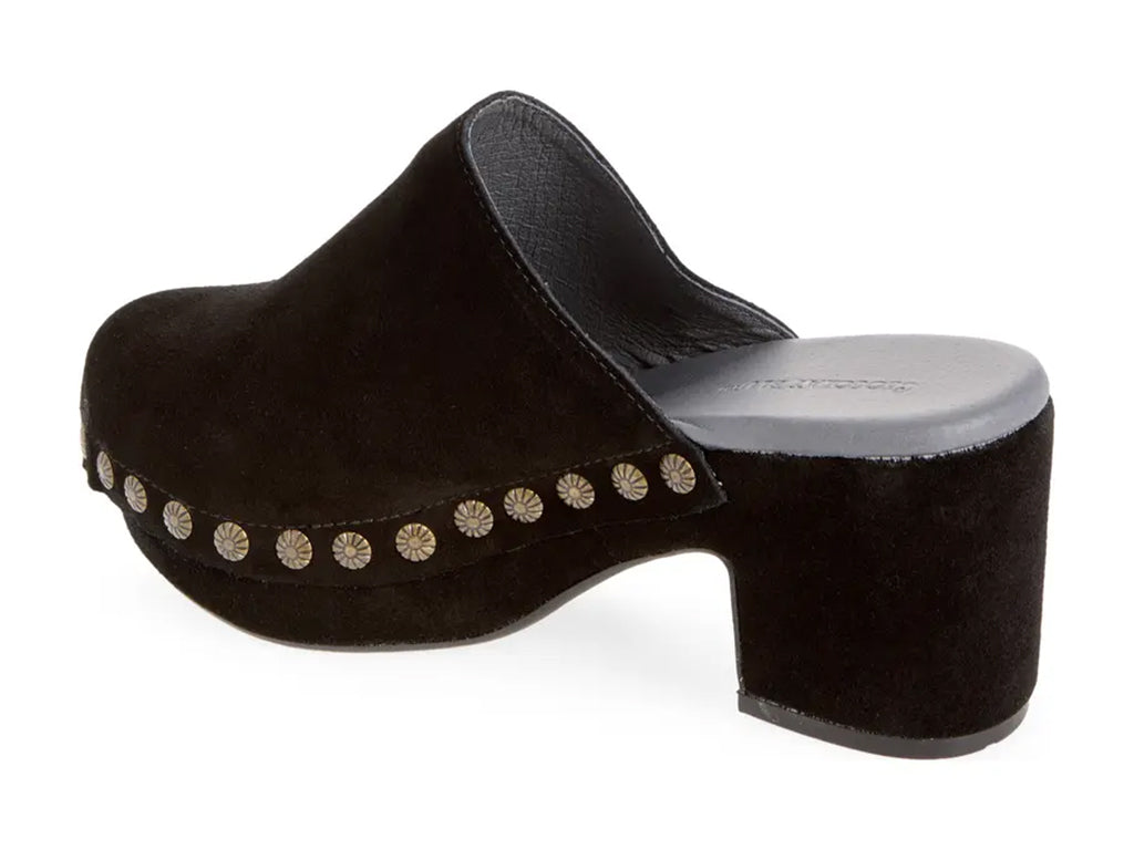 black suede clogs on a chunky platform with decorative metallic flower-shaped studs along the side - inner side view