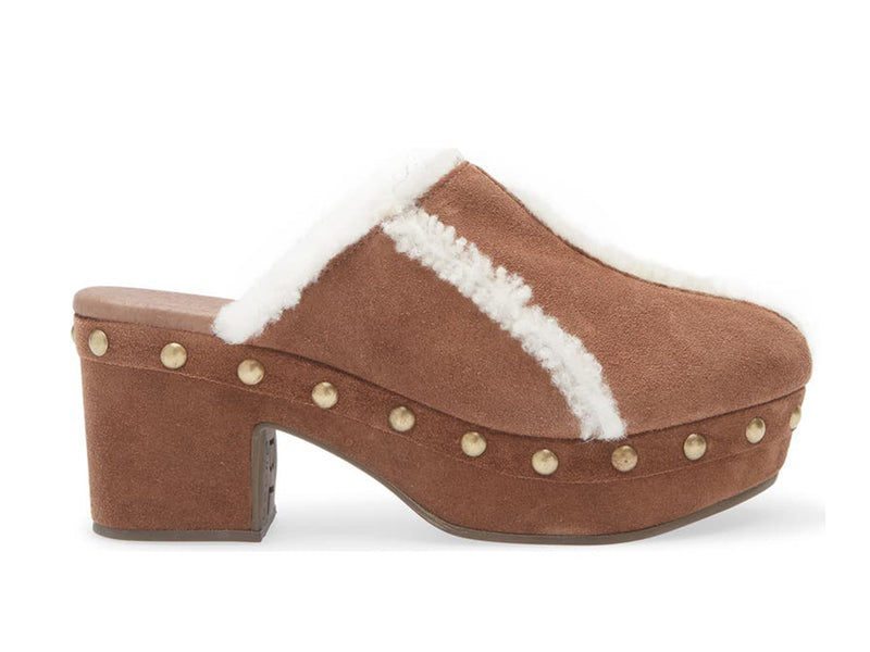Brown suede platform heeled clog with white fur lining and gold studs on a white background side view