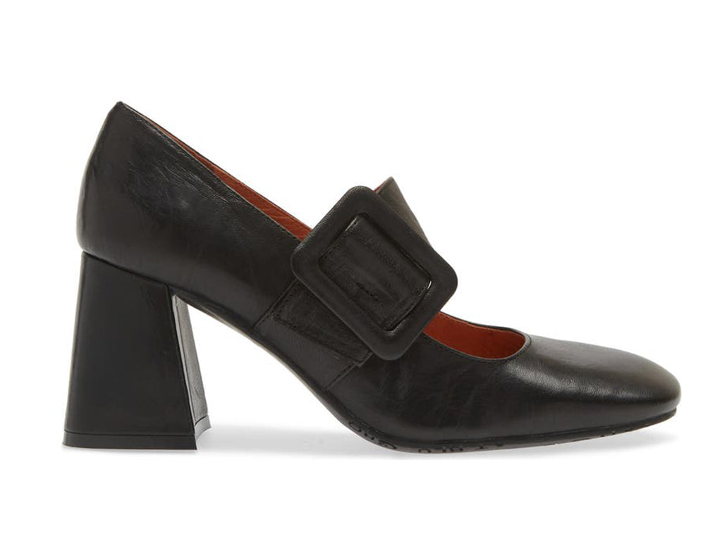Black leather shoe with block heel and decorative buckle on strap kaying over instep on a white background side view