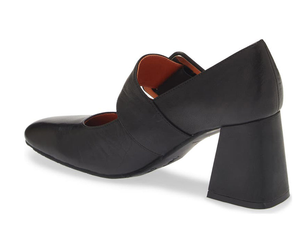 Black leather shoe with block heel and decorative buckle on strap kaying over instep on a white background side angle view