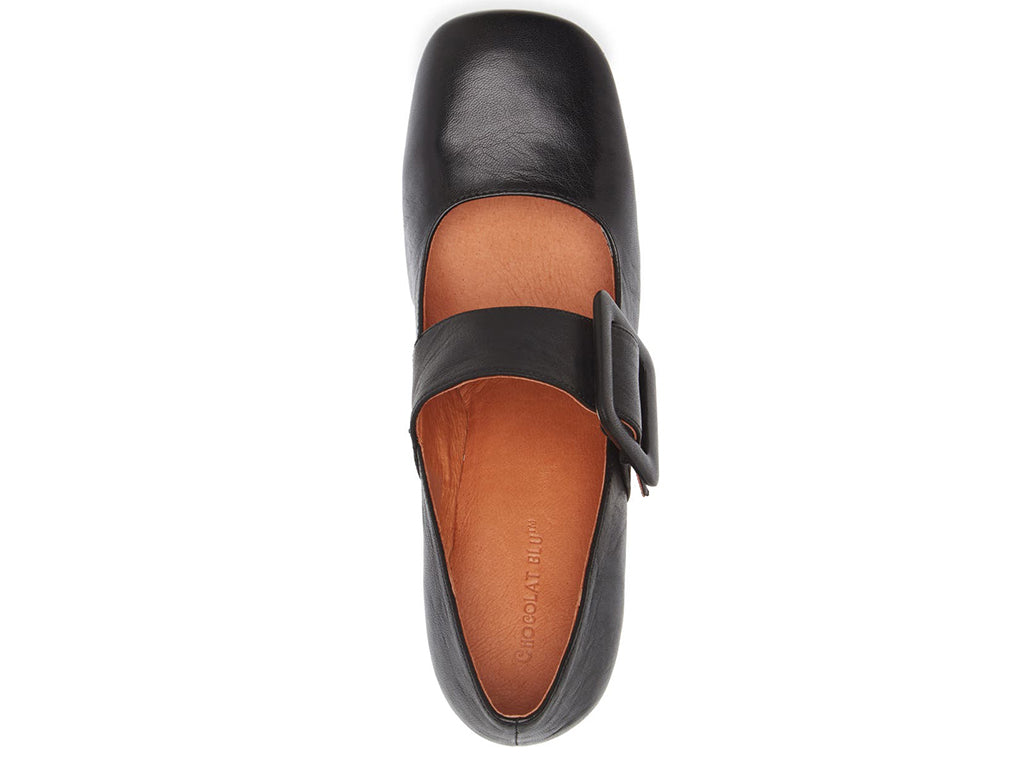 Black leather shoe with block heel and decorative buckle on strap kaying over instep on a white background top view