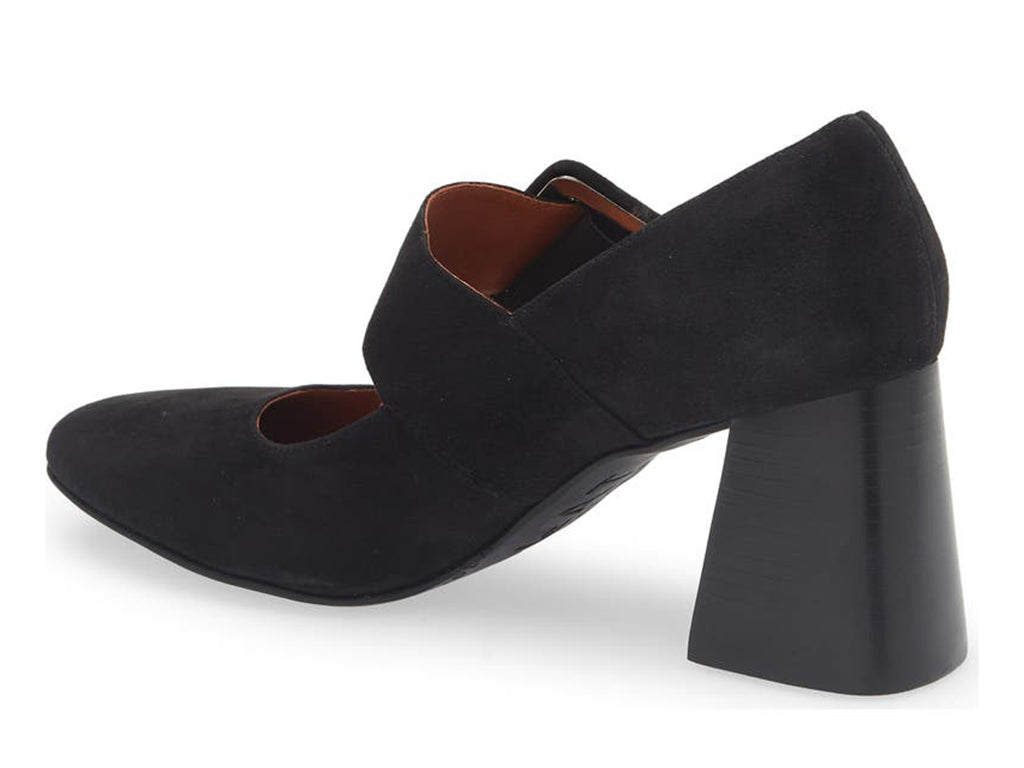 Black suede shoe with block heel and decorative buckle on strap kaying over instep on a white background side angle view