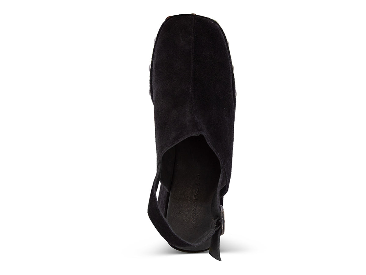 Black suede heeled clog platform shoe with gold studs and back ankle buckled strap on a white background top view