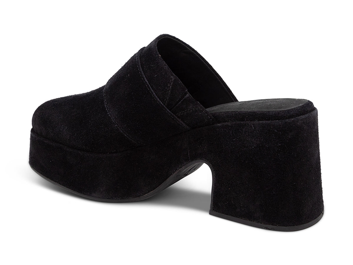 Black suede platform slide in block heeled clog with gold buckle on a white background side angle view