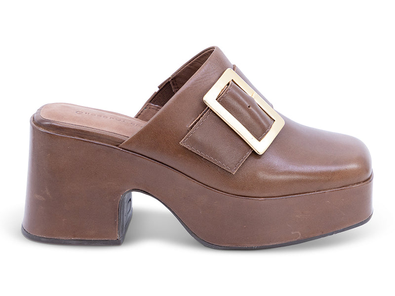 A brown leather platform clog shoe with a chunky block heel and a large gold-tone rectangular buckle - outer side view