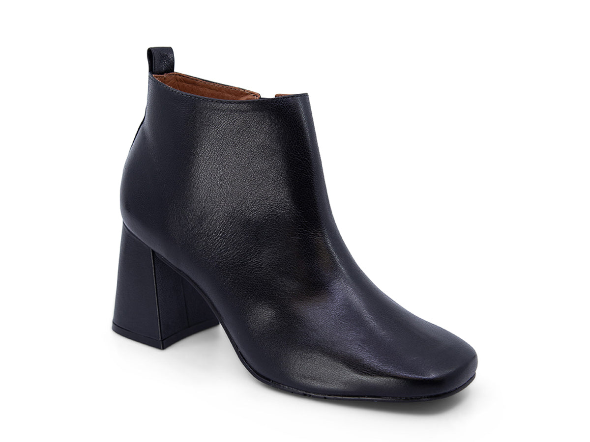 Black leather ankle boot with a block heel on a white background side angle view