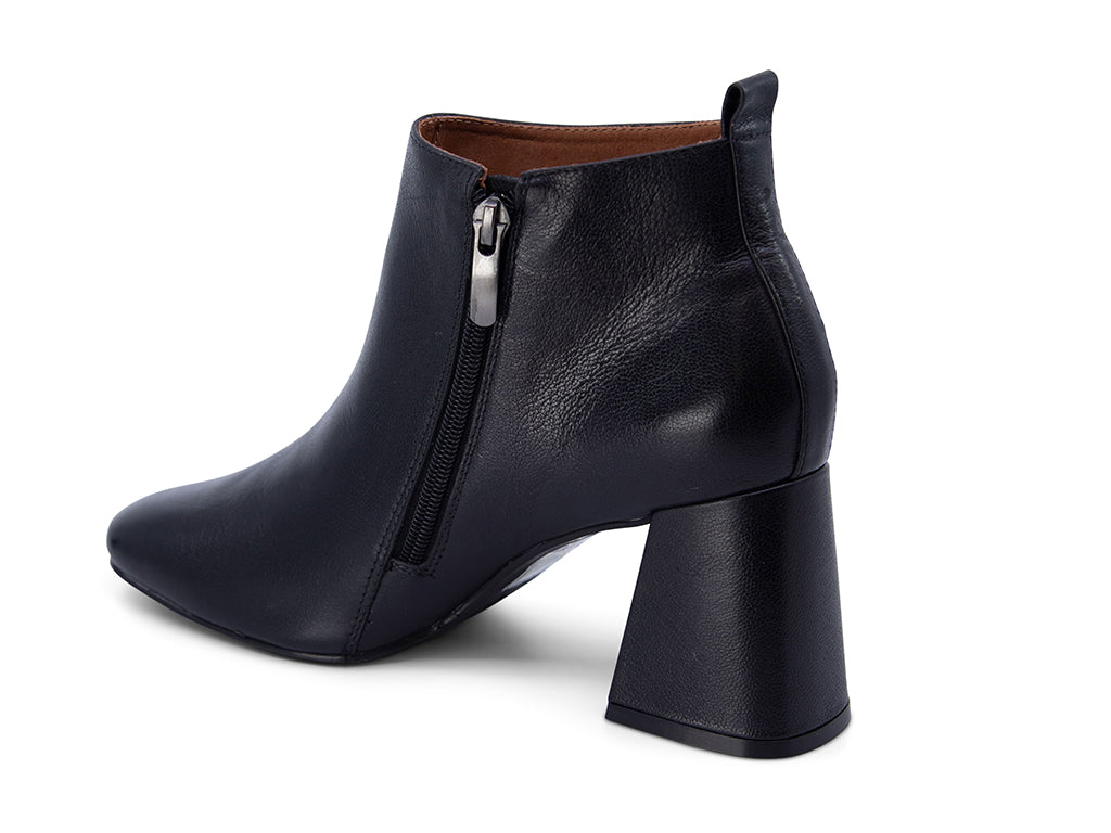 Black leather ankle boot with a block heel on a white background side angle view