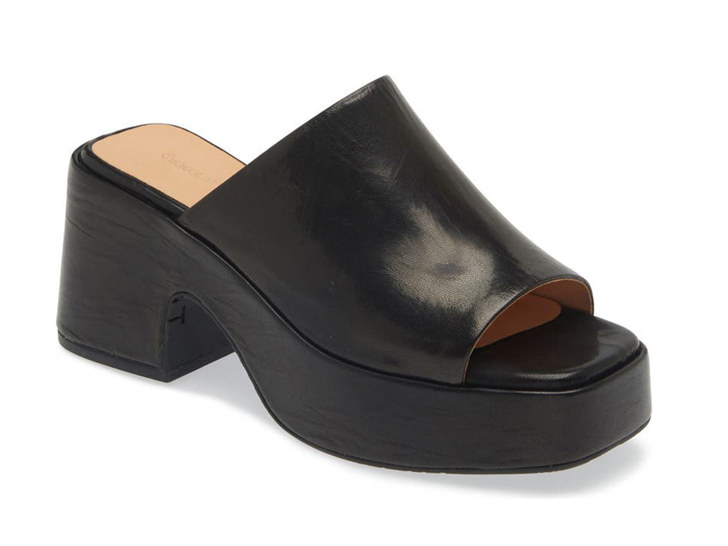 Black chunky heeled open toed platform mule with a leather upper on a white background side angle view