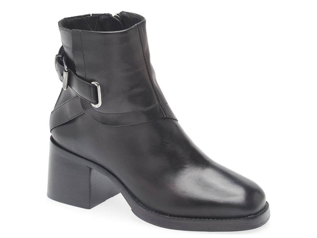 Black ankle boot with silver buckle and criss cross strap design on a white background side angle view