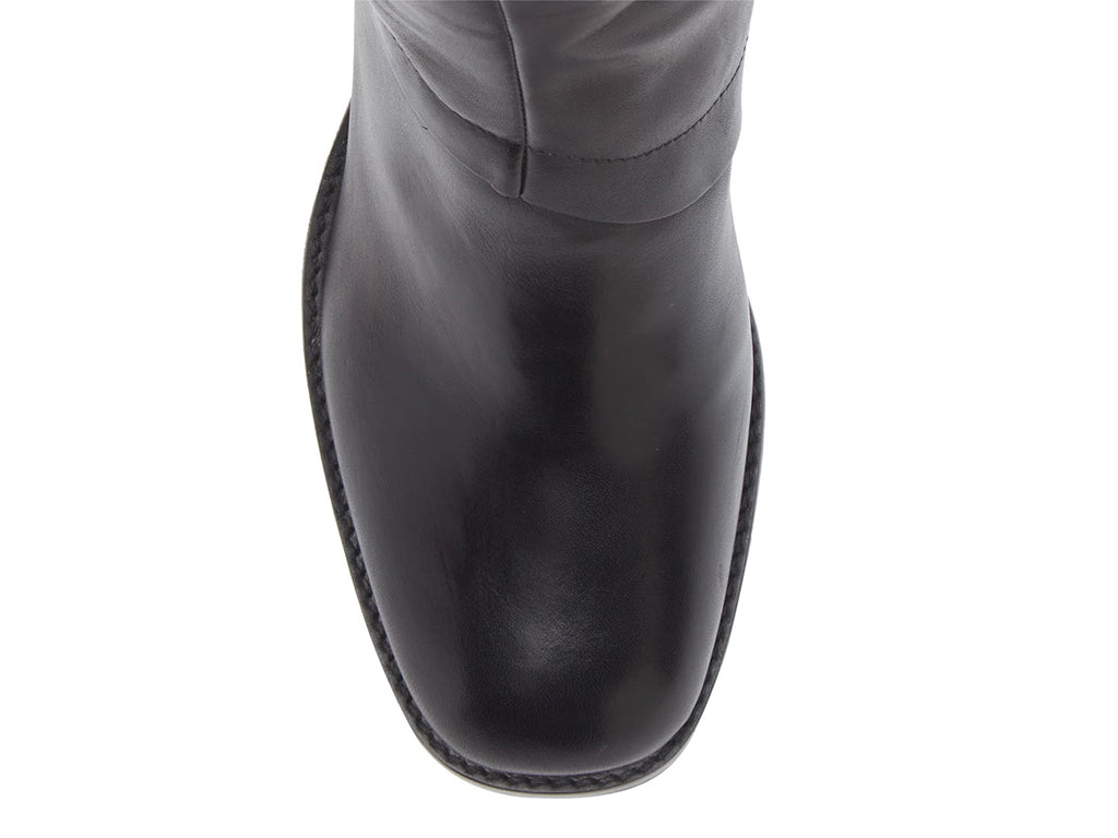 Black ankle boot on a white background top view