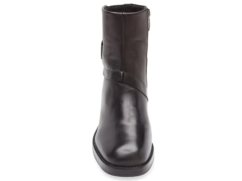 Black ankle boot with silver buckle and criss cross strap design on a white background front view