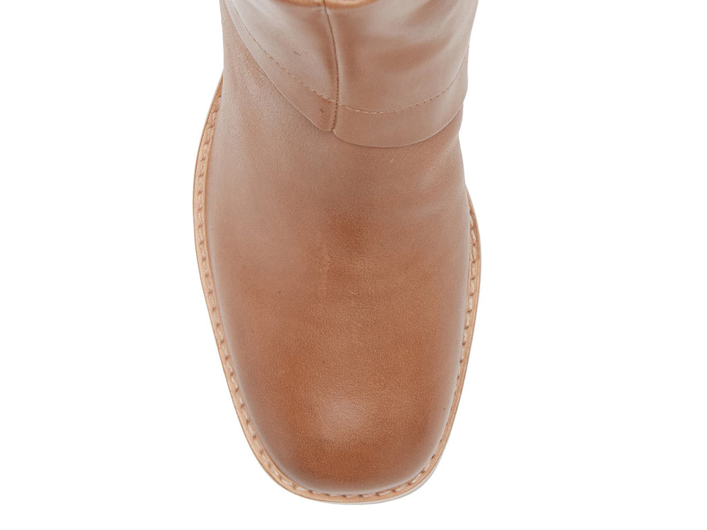 Tobacco color ankle boot on a white background top view