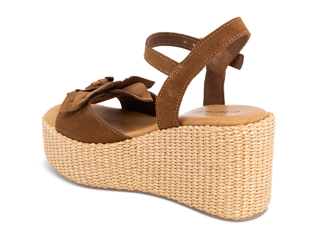 Brown wedge sandal with a flower detail and an ankle strap - view from the back