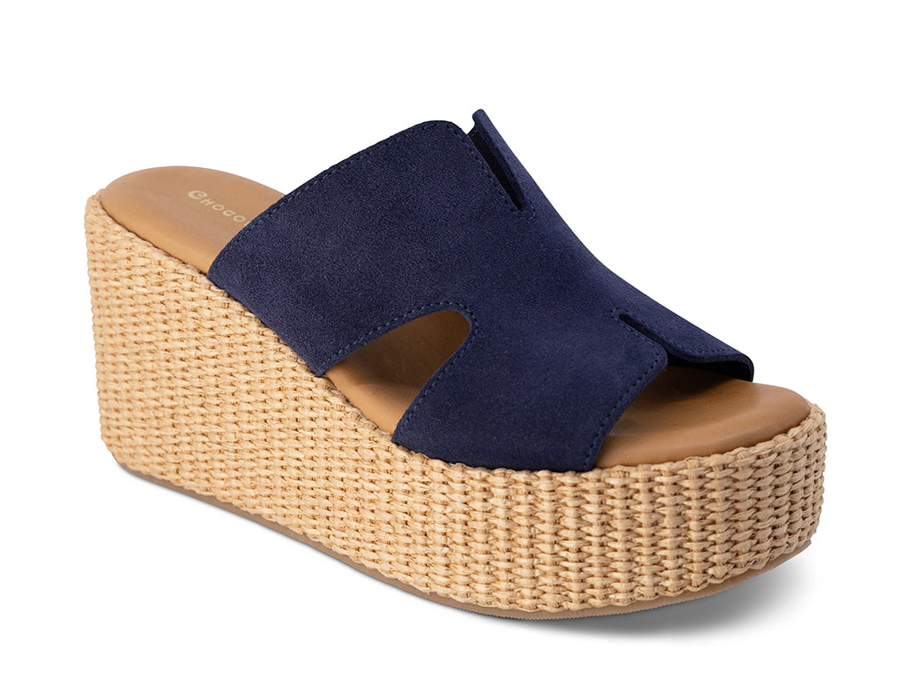 Navy wedge sandal with woven platform on a white background